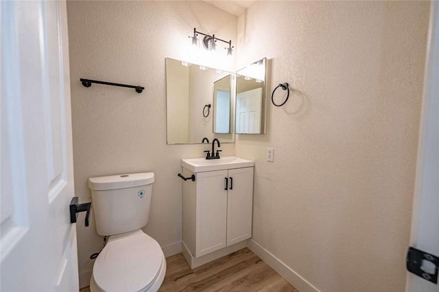 1925 E Ln Entrada Pl, Fort Mohave, AZ 86426 - bathroom with vanity, wood finished floors, and a textured wall