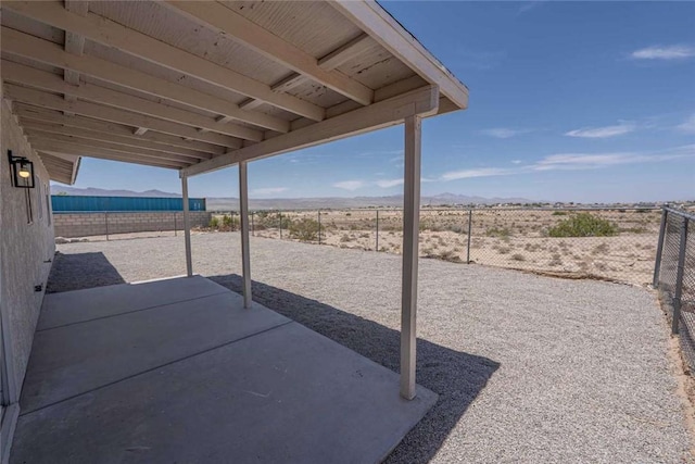 1925 E Ln Entrada Pl, Fort Mohave, AZ 86426 - fenced backyard featuring a patio and a mountain view