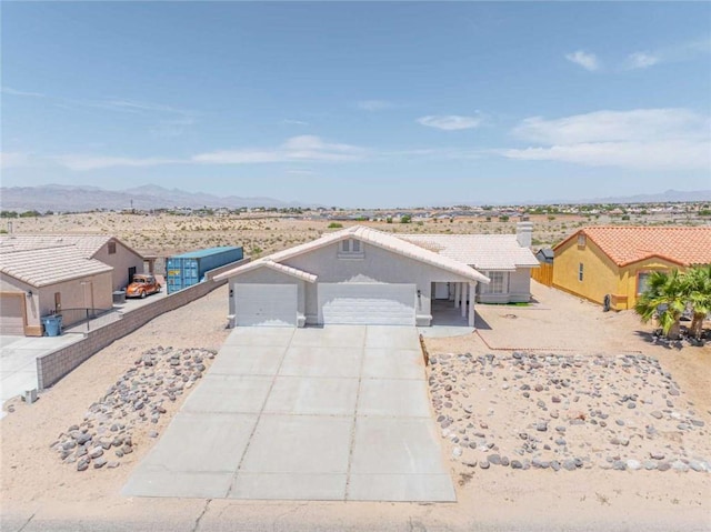 1925 E Ln Entrada Pl, Fort Mohave, AZ 86426 - ranch-style house with driveway, an attached garage, and a mountain view