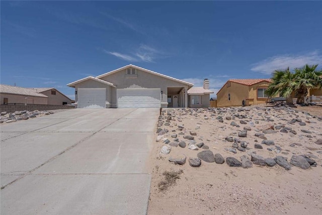 1925 E Ln Entrada Pl, Fort Mohave, AZ 86426 - ranch-style house featuring a garage, driveway, and stucco siding