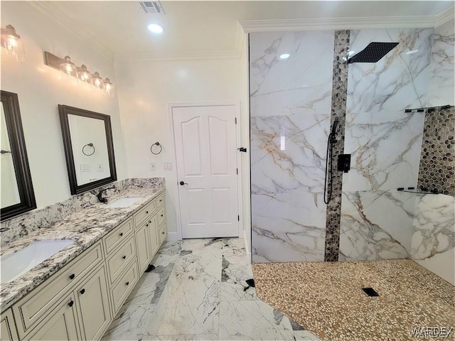 full bathroom featuring a marble finish shower, ornamental molding, a sink, and visible vents