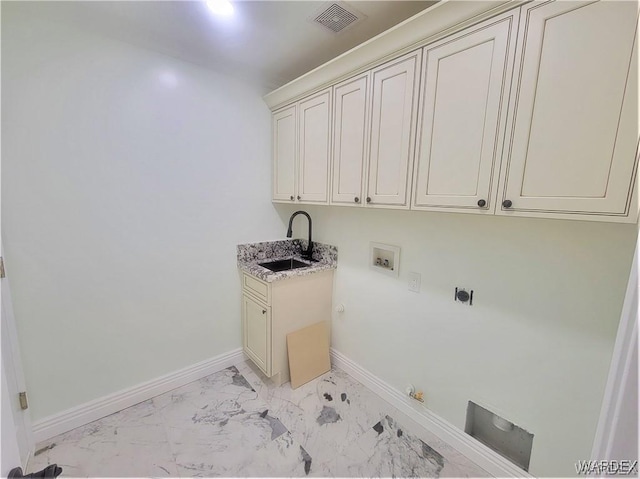 washroom with gas dryer hookup, hookup for a washing machine, a sink, baseboards, and marble finish floor