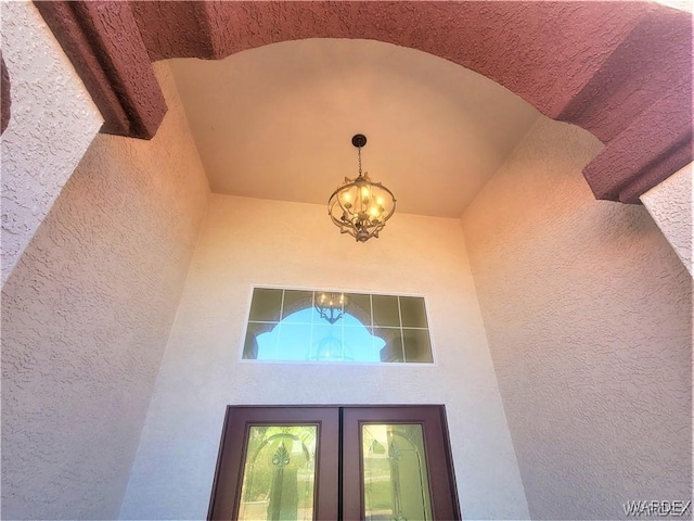 property entrance with stucco siding