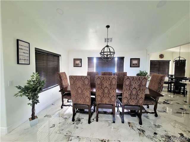 dining area with marble finish floor, ornamental molding, visible vents, and a notable chandelier