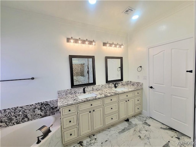 full bathroom with crown molding, marble finish floor, visible vents, and a sink