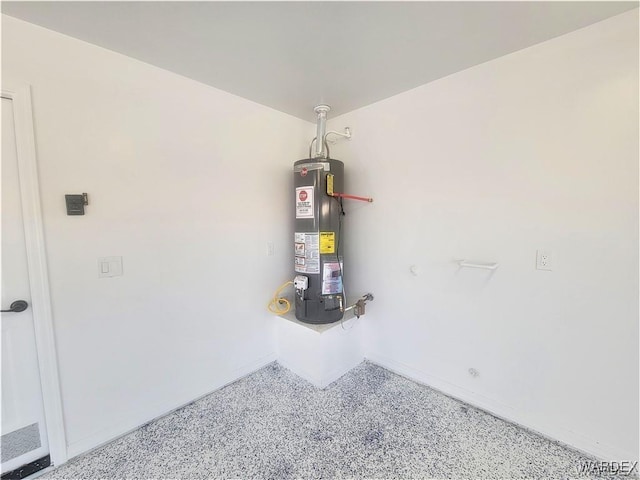 utility room with gas water heater