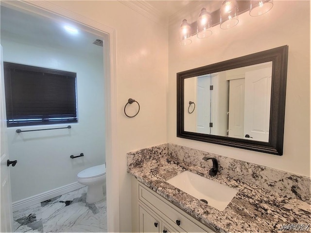 half bathroom featuring toilet, vanity, baseboards, marble finish floor, and crown molding