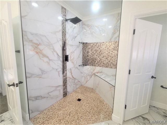 bathroom featuring marble finish floor, a marble finish shower, and crown molding