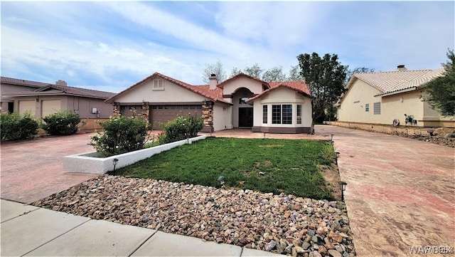 view of front of property featuring stucco siding, a chimney, an attached garage, decorative driveway, and a front yard