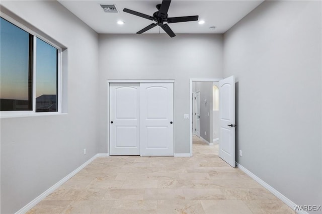 unfurnished bedroom with recessed lighting, a closet, visible vents, and baseboards