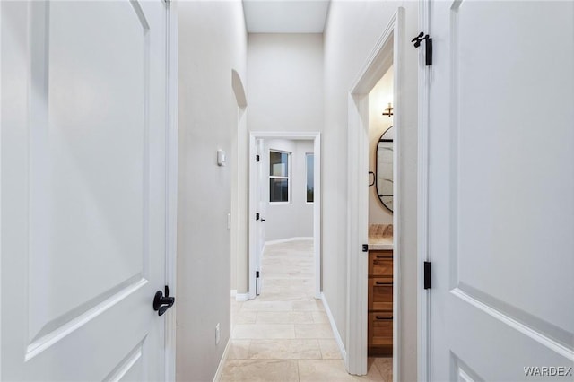 corridor featuring baseboards