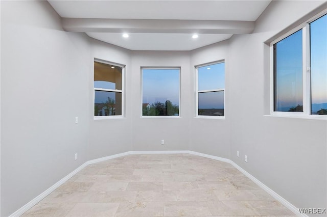 unfurnished room with recessed lighting, beam ceiling, and baseboards