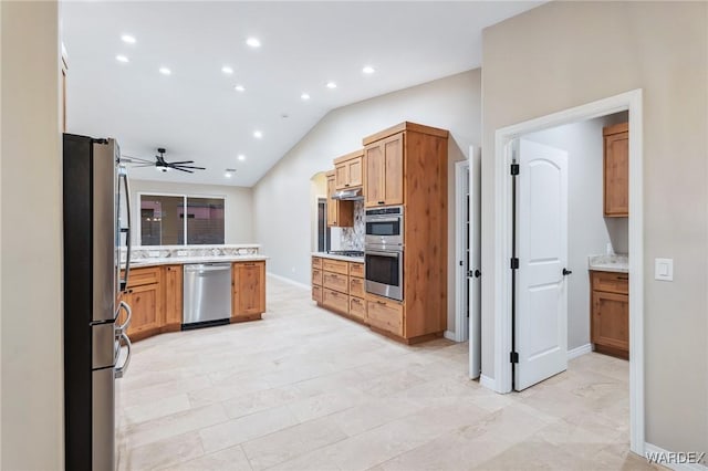 kitchen with stainless steel appliances, recessed lighting, brown cabinetry, vaulted ceiling, and ceiling fan