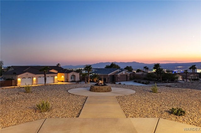 ranch-style house with a garage and a residential view