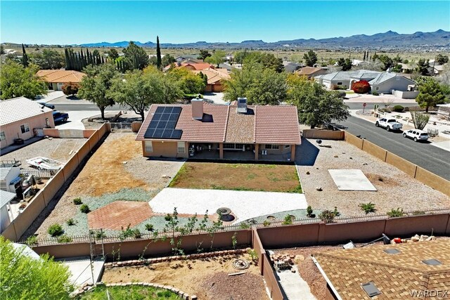 birds eye view of property with a residential view and a mountain view