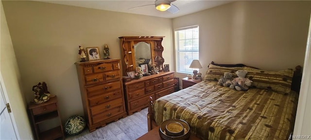 bedroom featuring light wood finished floors and ceiling fan