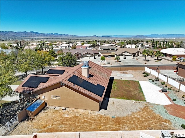 drone / aerial view featuring a residential view and a mountain view