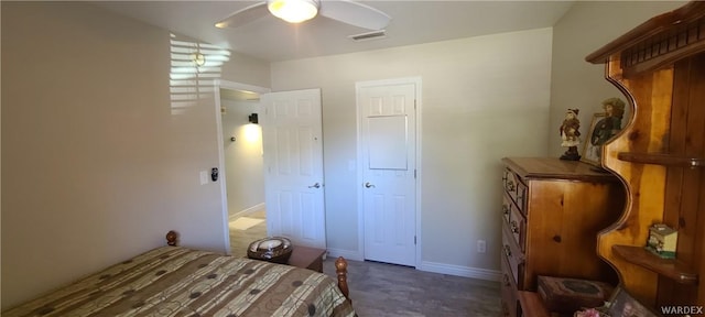 bedroom with ceiling fan, visible vents, and baseboards