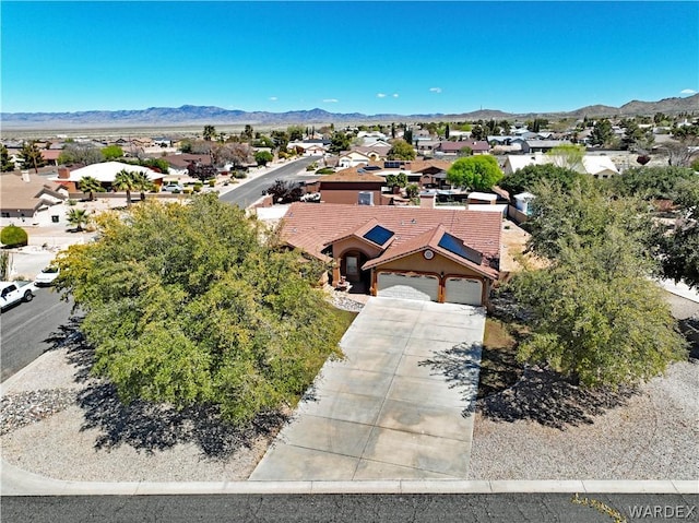 bird's eye view featuring a residential view and a mountain view