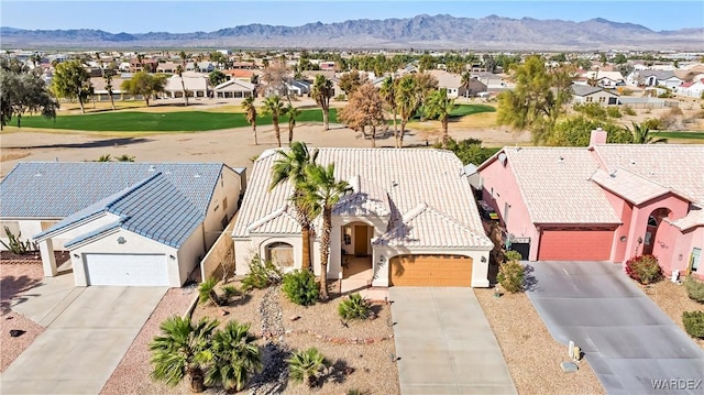 birds eye view of property with a residential view and a mountain view