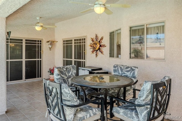 view of patio / terrace with a ceiling fan and outdoor dining space