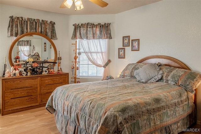 bedroom featuring a ceiling fan and wood finished floors