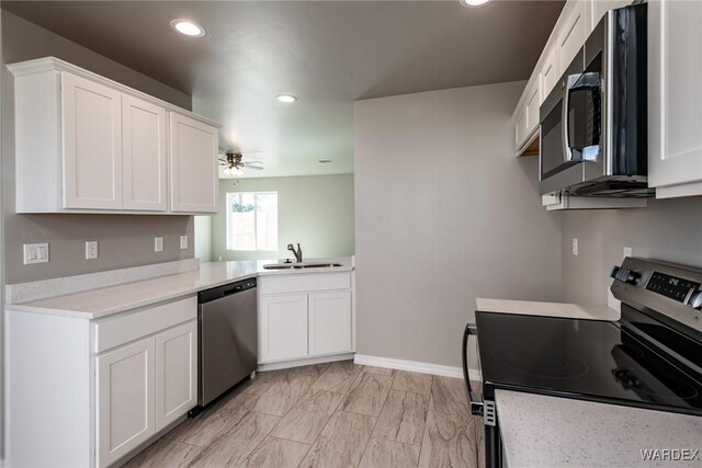 interior space featuring visible vents, baseboards, and a ceiling fan