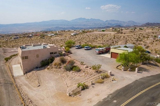 birds eye view of property featuring a mountain view