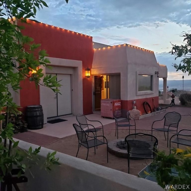 view of patio terrace at dusk