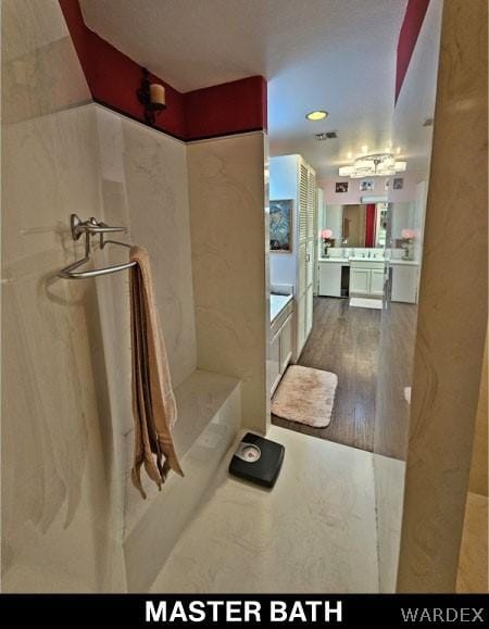 full bath featuring wood finished floors and vanity