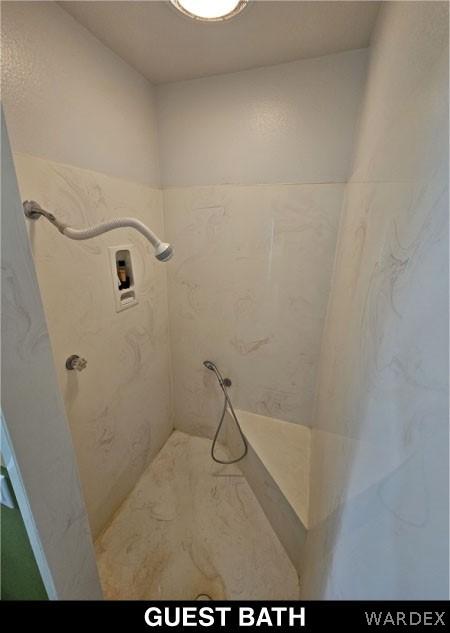 bathroom featuring a shower