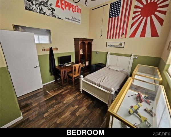 bedroom featuring dark wood finished floors