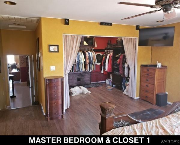 bedroom featuring dark wood-style flooring and a closet