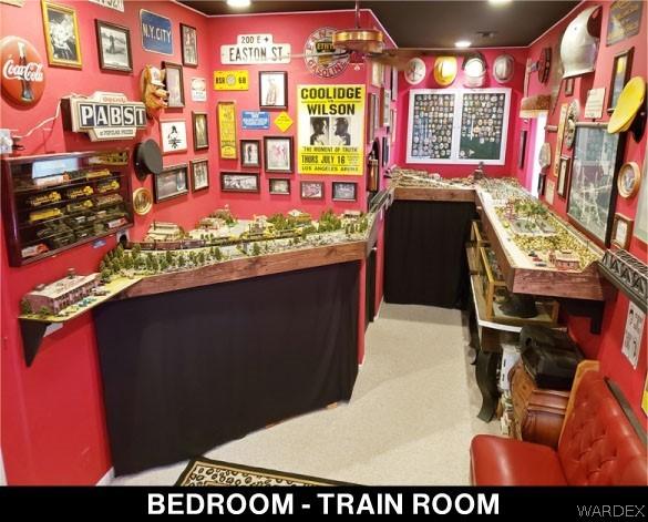 game room featuring a bar and carpet flooring