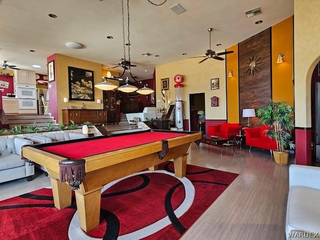 playroom featuring a ceiling fan, visible vents, wood finished floors, and pool table