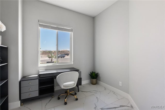 home office with marble finish floor and baseboards