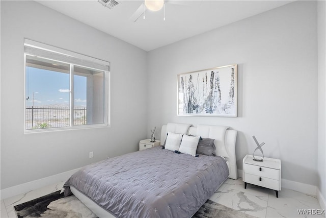 bedroom featuring marble finish floor, visible vents, baseboards, and a ceiling fan