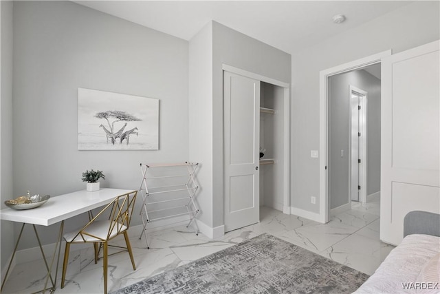 interior space with marble finish floor and baseboards