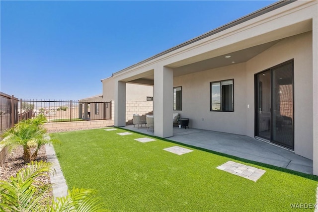 view of yard featuring a patio area and a fenced backyard