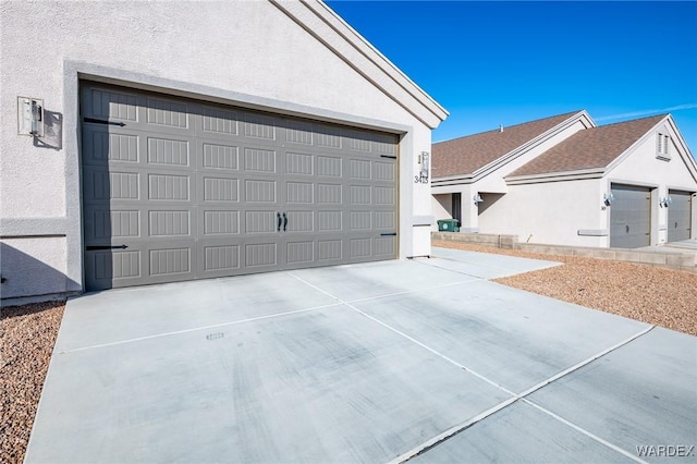 garage featuring driveway