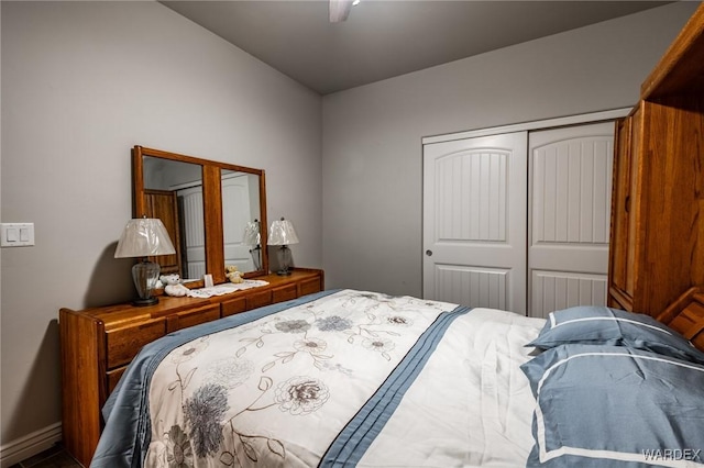 bedroom with a closet, a ceiling fan, and baseboards