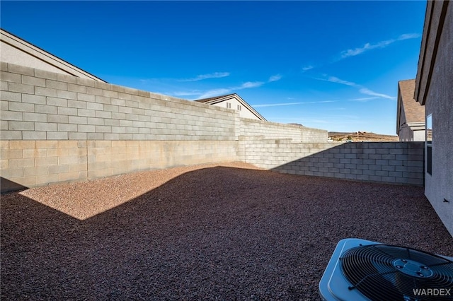 view of yard featuring a fenced backyard and cooling unit