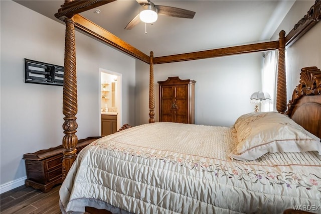 bedroom with a ceiling fan, connected bathroom, baseboards, and dark wood-type flooring