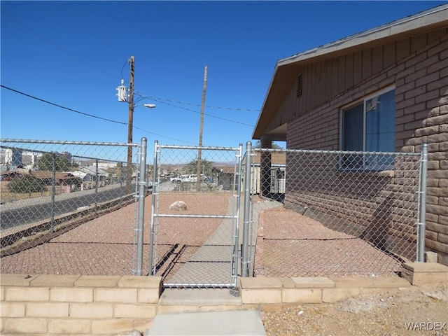 exterior space featuring fence and a gate