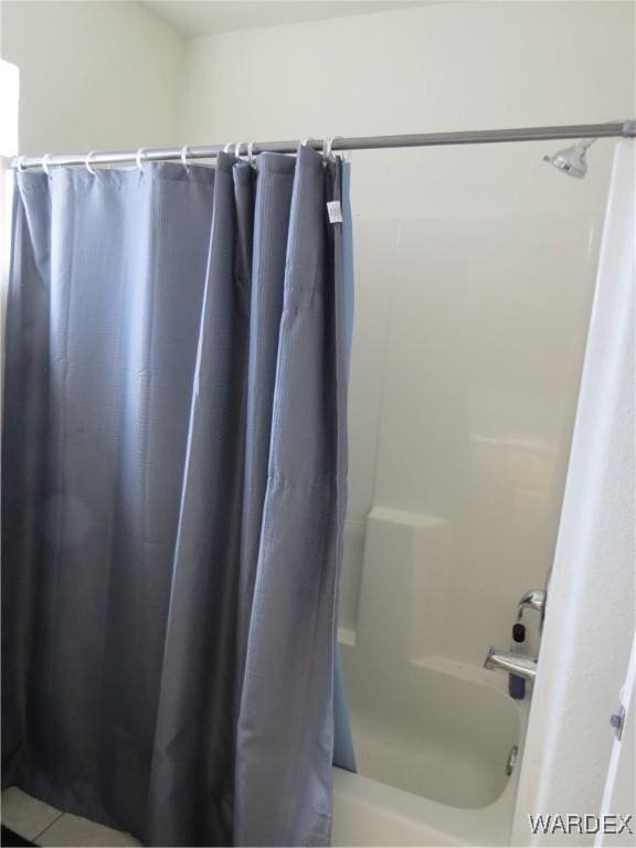 full bathroom with shower / tub combo