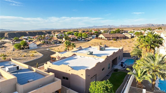 drone / aerial view featuring a residential view and a mountain view