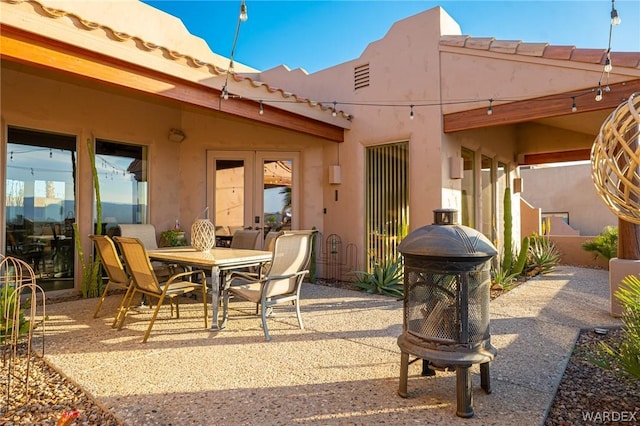 view of patio / terrace with an outdoor fire pit and outdoor dining space