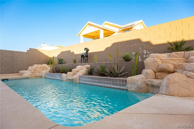 view of pool with a fenced backyard and a fenced in pool