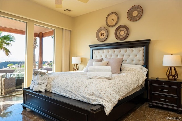 bedroom featuring a ceiling fan, access to outside, and visible vents