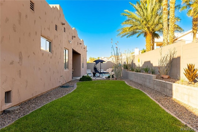 view of yard with a patio area and a fenced backyard